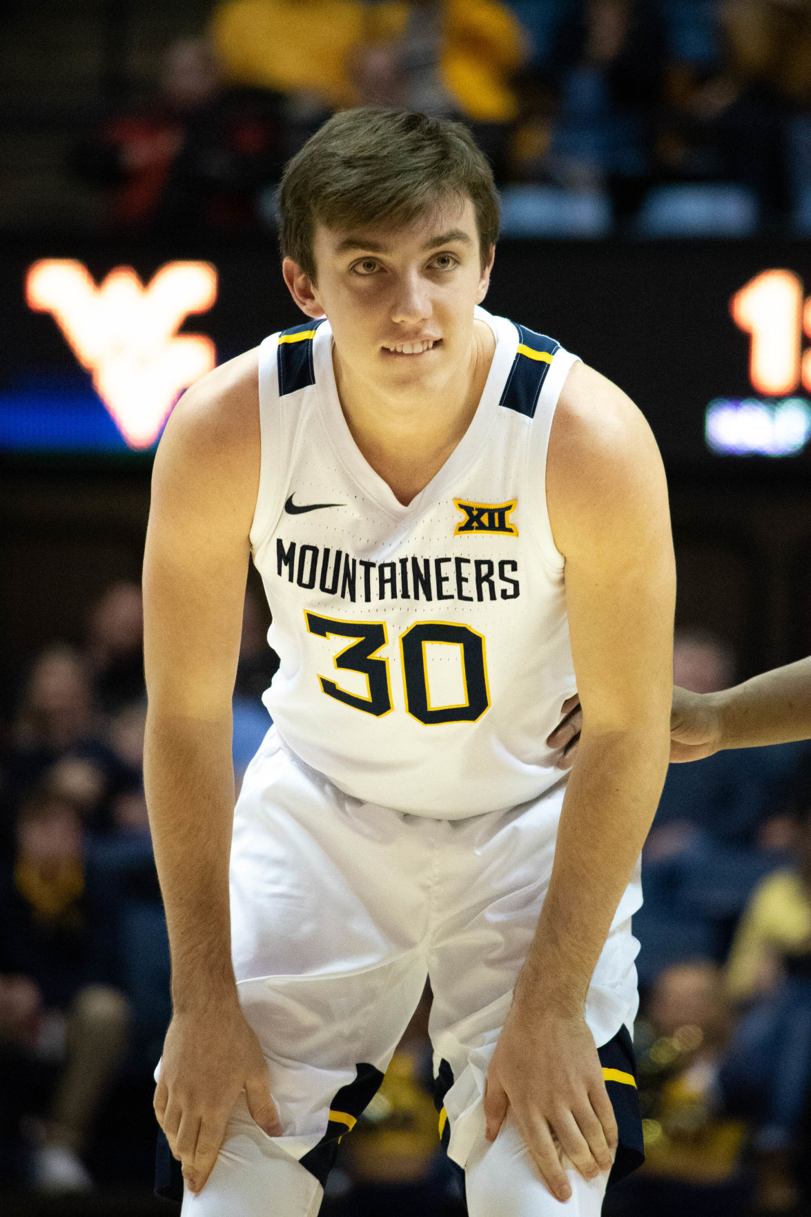 West Virginia guard Spencer Macke observes during a break in the action.